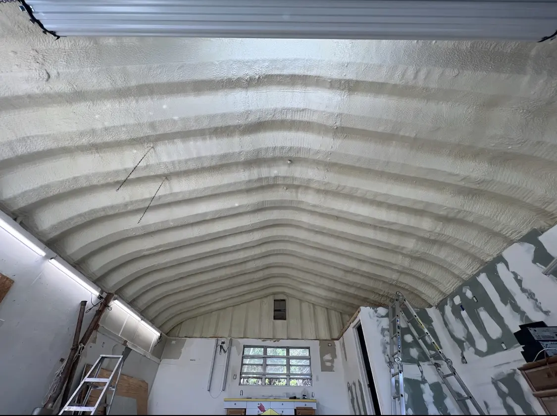 Spray polyurethane foam applied to the underside of a metal roof deck in Villa Park